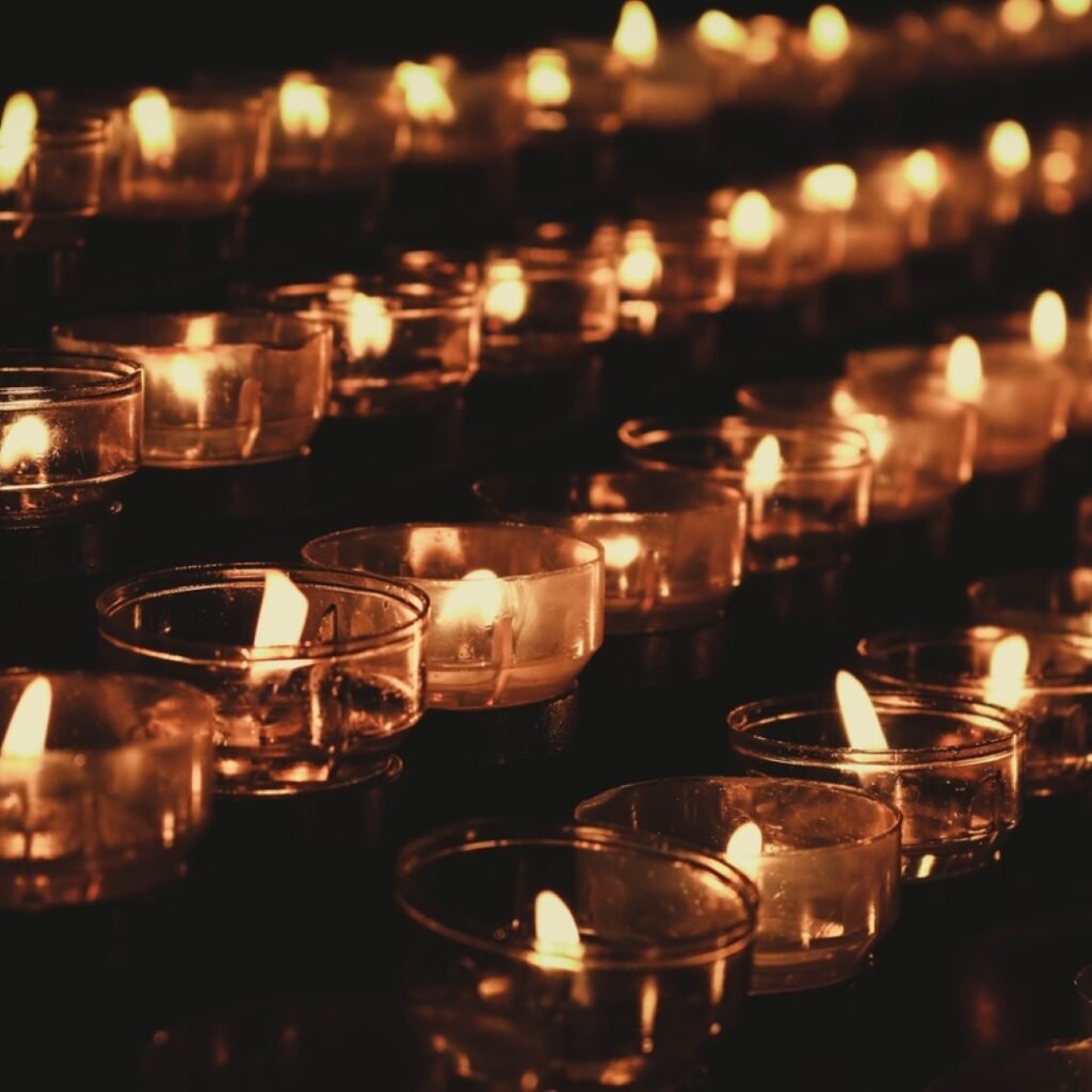 Lighted tealight candle holders. Original public domain image from Wikimedia Commons
